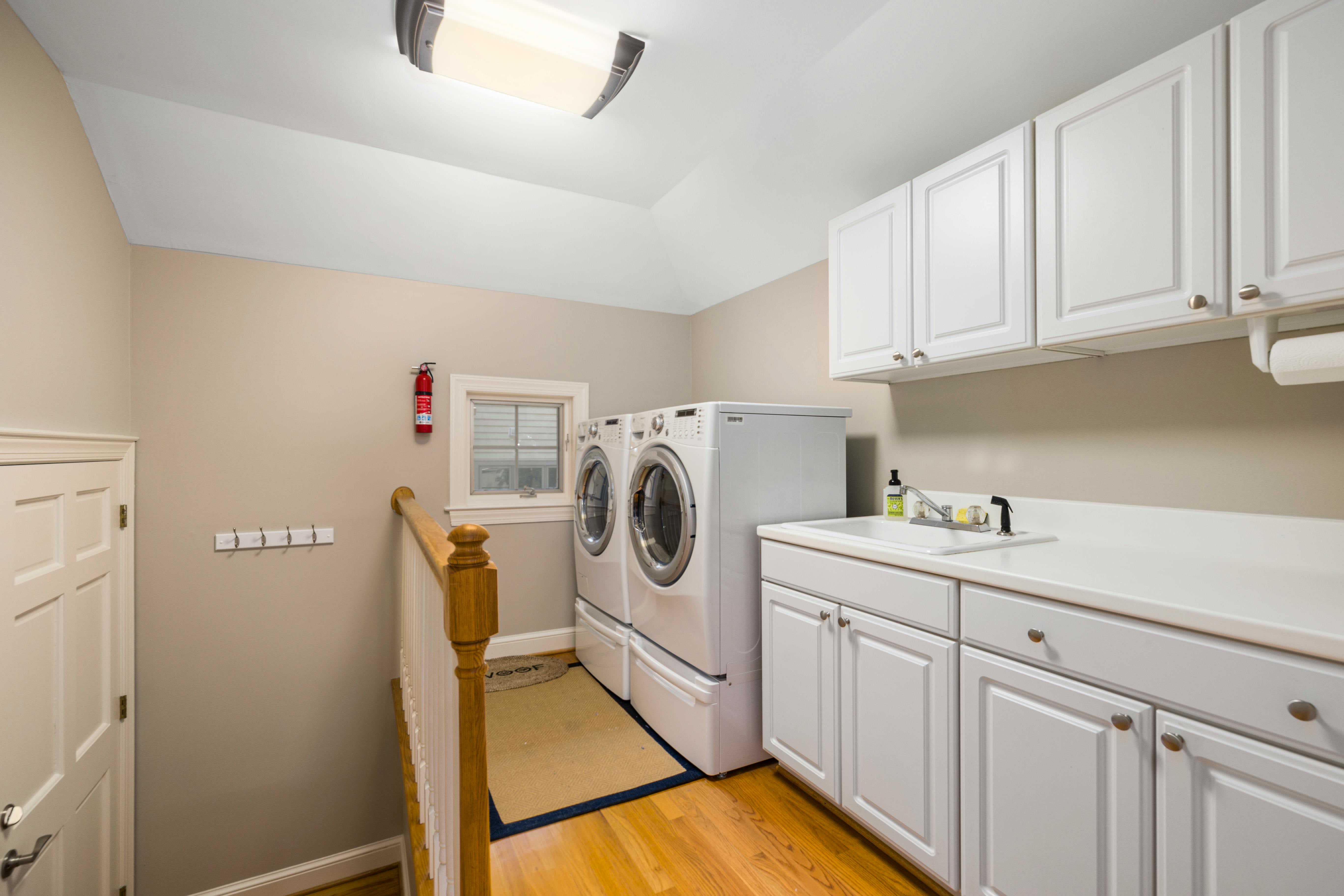 custom built laundry cabinets and shelving